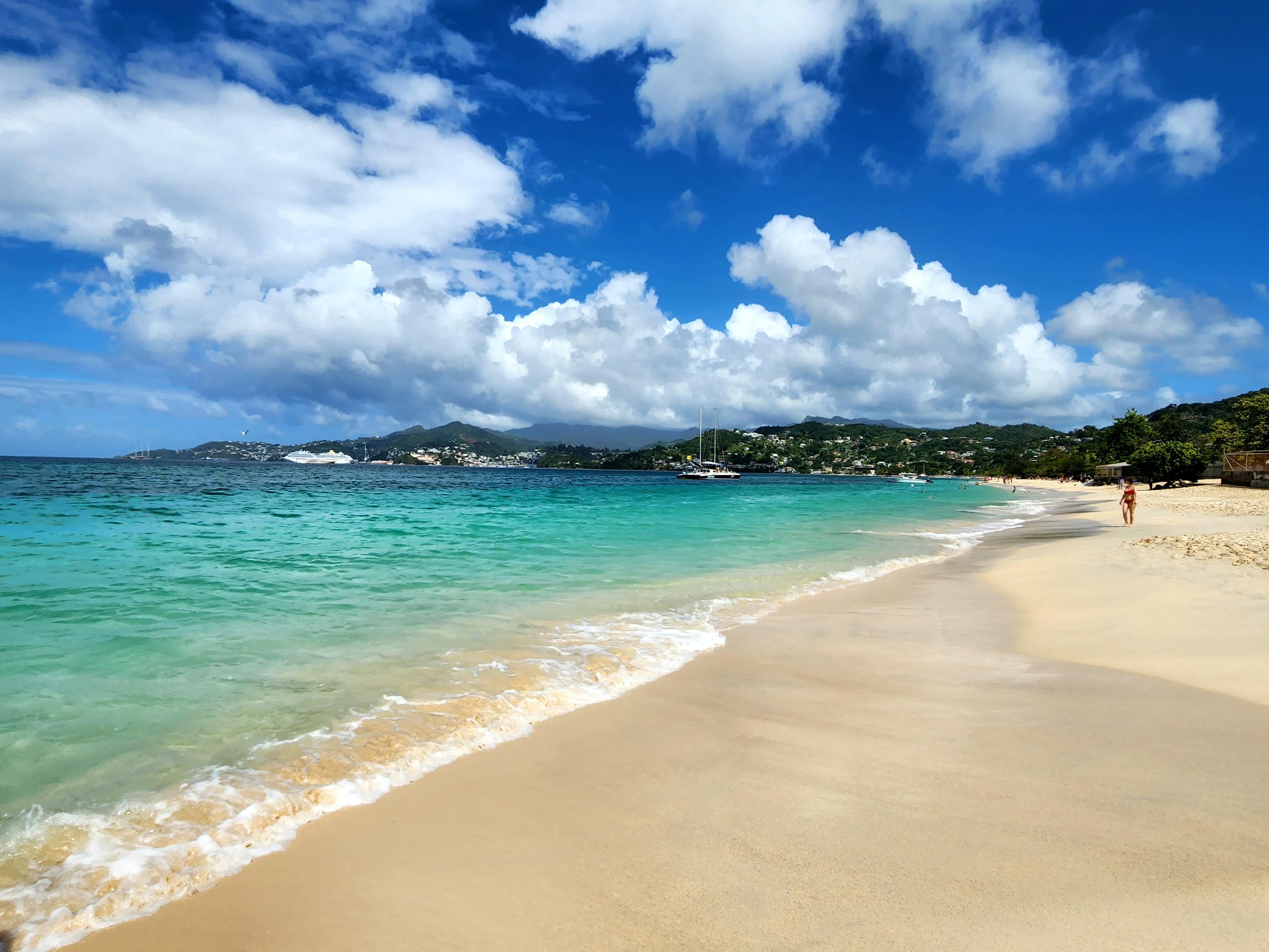 Shoreline and turquoise water under a bright sky.