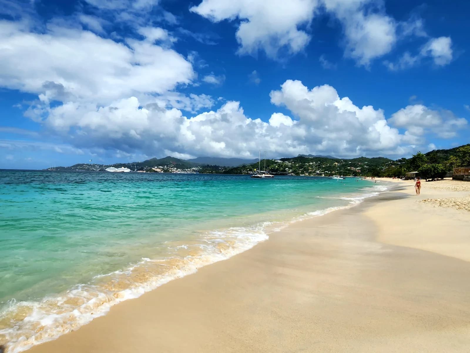 Shoreline and turquoise water under a bright sky.